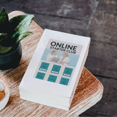 Auf einem Tisch liegt ein Buch mit dem Titel: Online Starter Club - dabei geht es darum, wie du mit deiner Expertise ein Online Business aufbaust